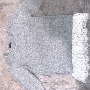 Sweater with lace attached
